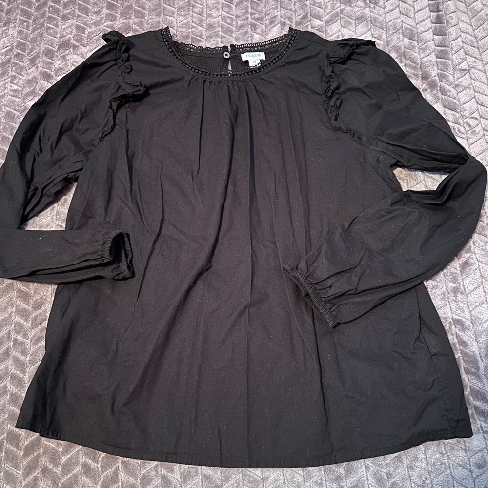 Black shirt with ruffle trim